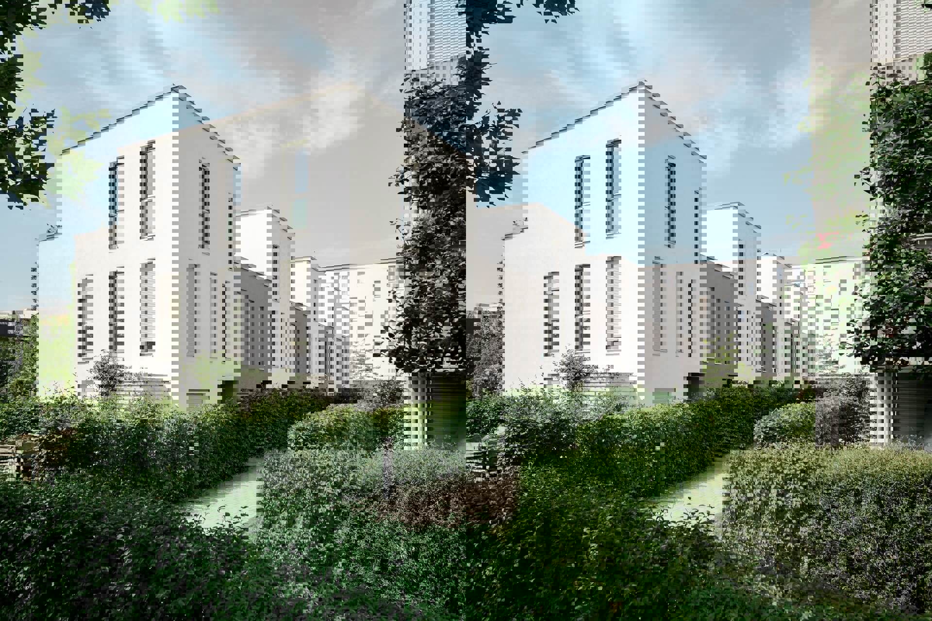 Verbruik gas elektra | Witte huizen en appartementen in een groene buurt
